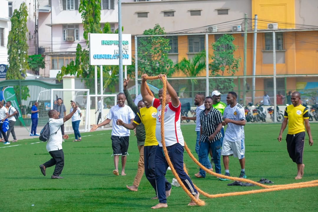 Employees participating in tug-of-war competition